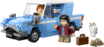 Blue LEGO van with a white roof and clear windshield; a man with glasses and a red plaid shirt stands by the side, while a white owl, a small brown suitcase, and a toy horse lie nearby.